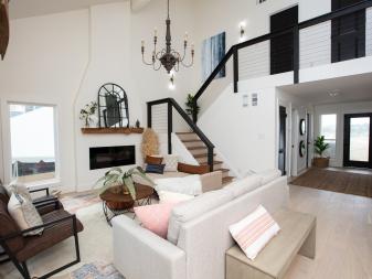 As seen on HGTV's Battle on the Beach, team Taniya transformed this living room giving it a Mediterranean meets Texas style.  The redesign includes rerouted stairs, a fireplace, new lighting and furniture. (Afters) (Corner 4)